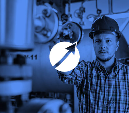 Plutoshift logo over a blue-screened worker in a factory