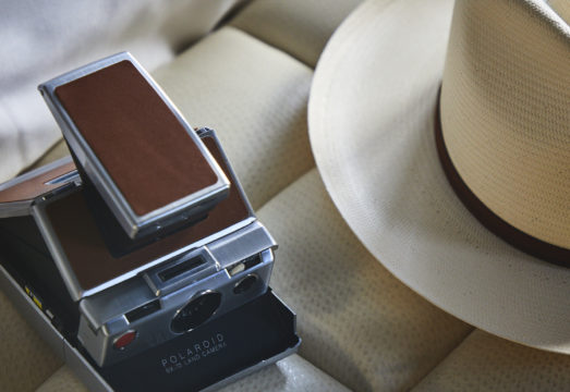 Polaroid camera and hat