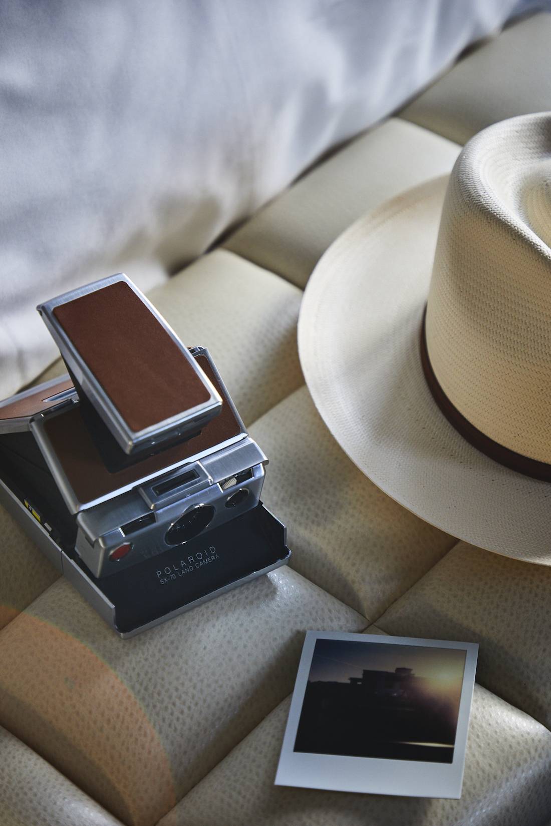 Polaroid camera and hat