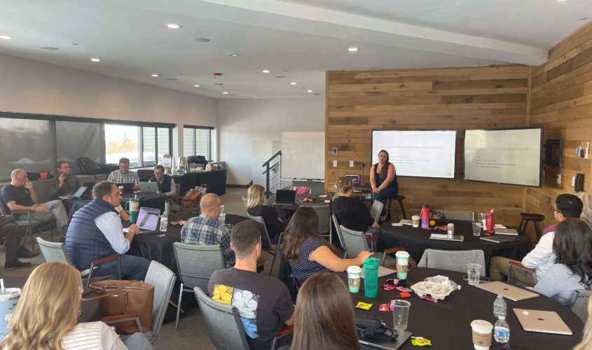 GCommerce employees listening during a presentation